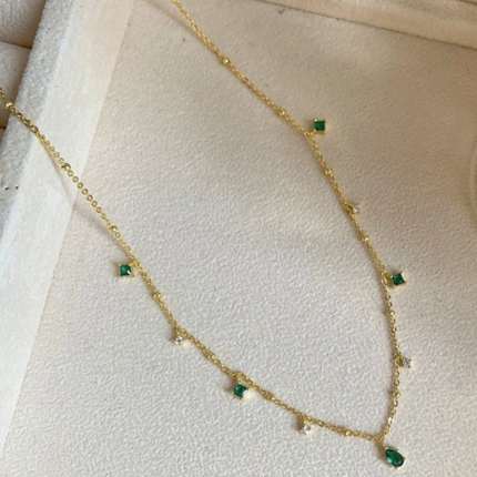 Gold/silver chain necklace with emerald and cubic zirconia