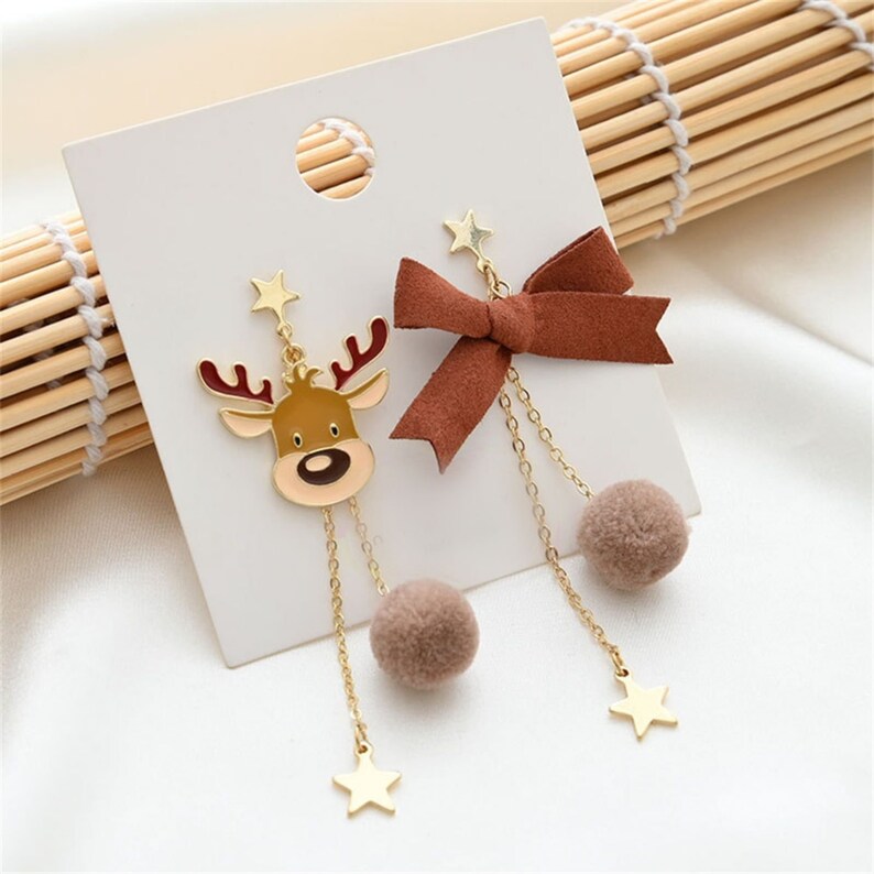 "Christmas Elk Bow Dangle Earrings" "Holiday-Themed Women's Accessories" "Cute Christmas Fashion Jewelry" "Festive Season Sparkle Earrings" "Trendy Christmas Reindeer Earrings"