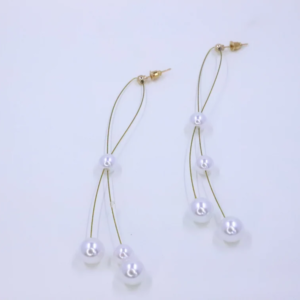 visual appeal, faux pearl material, length of the drop, gold tassel chain design