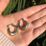 French Retro Gold Plated Chunky Hoop Earrings displayed on a jewelry stand.