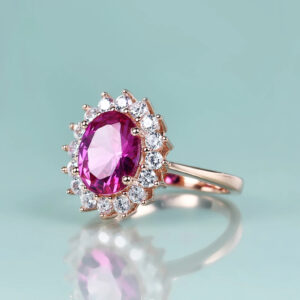 The Princess Diana inspired pink sapphire ring placed in a luxury jewelry box, ready for gifting.